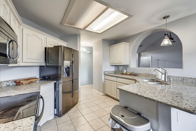 kitchen featuring stove, sink, hanging light fixtures, light tile patterned flooring, and fridge with ice dispenser