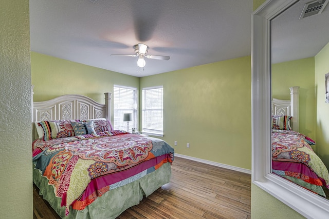 bedroom featuring ceiling fan and light wood-type flooring