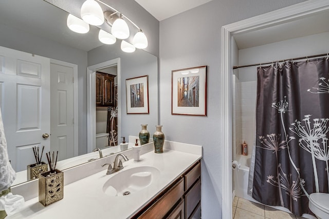 bathroom with shower / bath combo with shower curtain, tile patterned flooring, and vanity