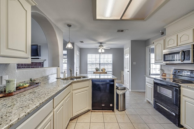 kitchen with ceiling fan, sink, decorative light fixtures, light tile patterned flooring, and black appliances