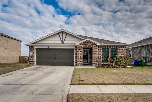 ranch-style house featuring a garage and a front yard