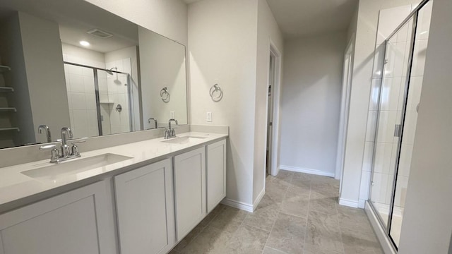 4224 Lucy Ln, Sherman, TX 75090 - bathroom with a stall shower, double vanity, and baseboards