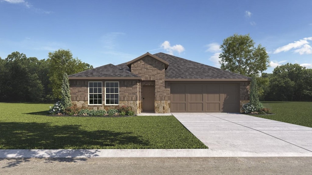 view of front of house featuring a garage and a front lawn