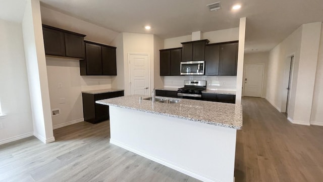 4219 Sky Dr, Sherman, TX 75090 - kitchen featuring stainless steel appliances, light wood-style flooring, backsplash, baseboards, and recessed lighting