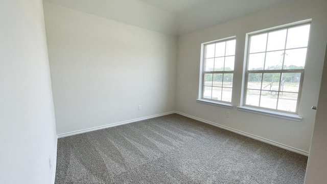 4219 Sky Dr, Sherman, TX 75090 - empty room featuring dark carpet and baseboards