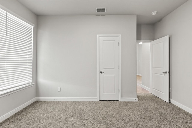 unfurnished bedroom featuring carpet flooring