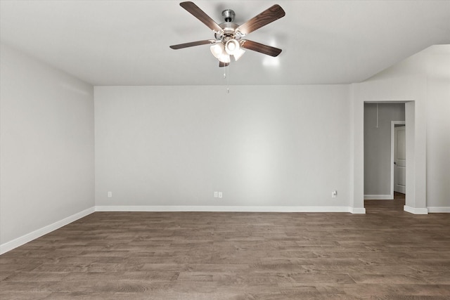 empty room featuring ceiling fan and dark hardwood / wood-style flooring