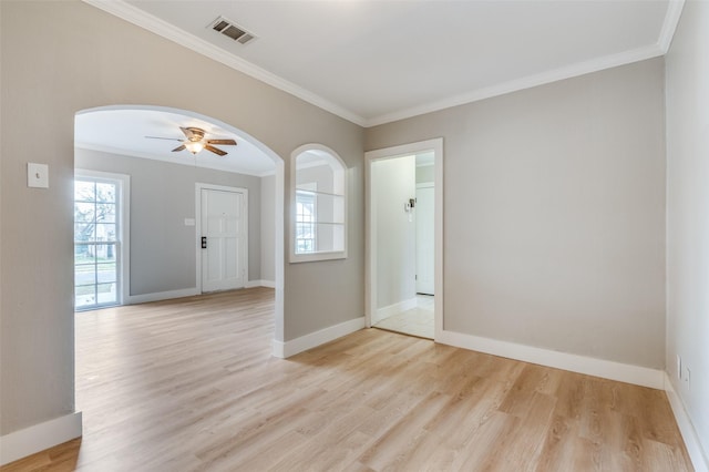 unfurnished room with ceiling fan, crown molding, and light hardwood / wood-style flooring