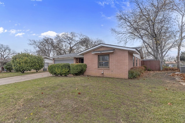 view of front facade with a garage and a front lawn