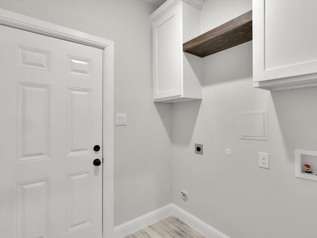 washroom with gas dryer hookup, cabinets, washer hookup, electric dryer hookup, and light hardwood / wood-style flooring