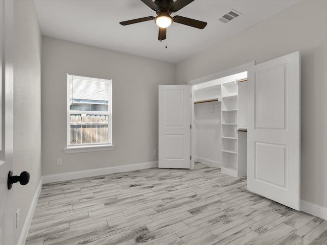 unfurnished bedroom with a closet, ceiling fan, and light wood-type flooring