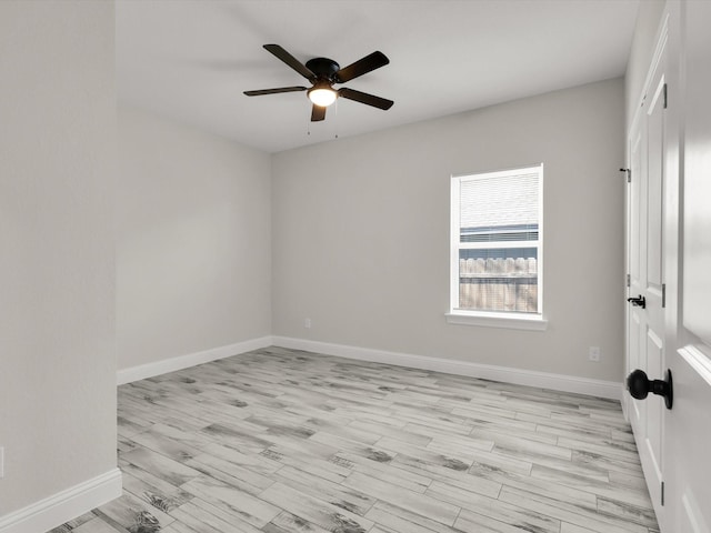 spare room featuring ceiling fan and light hardwood / wood-style floors