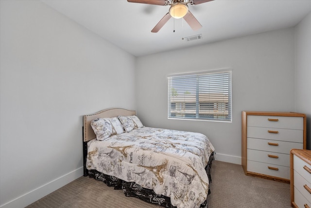 bedroom with ceiling fan and light carpet