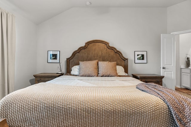 bedroom with vaulted ceiling