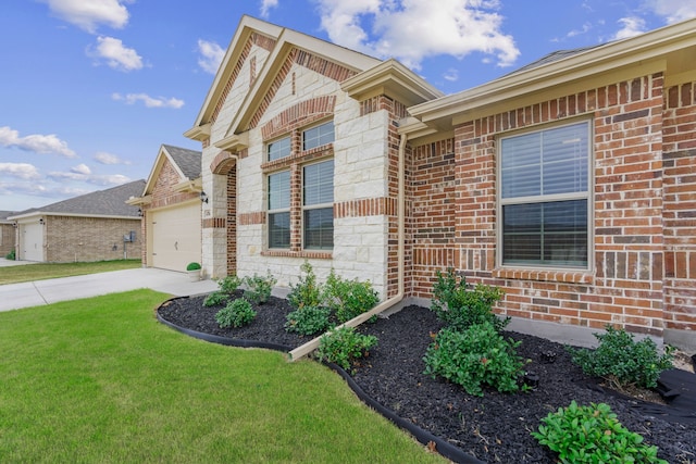 view of front of property with a front yard and a garage