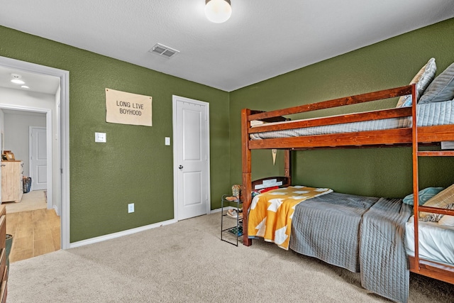 bedroom featuring carpet flooring and a closet