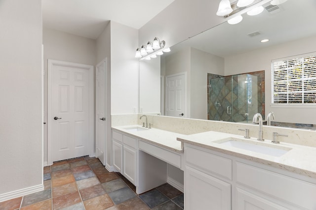 bathroom featuring an enclosed shower and vanity