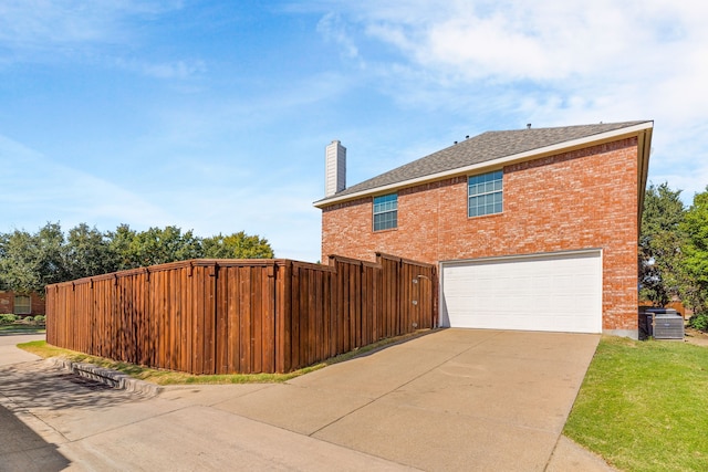 view of side of property with a garage