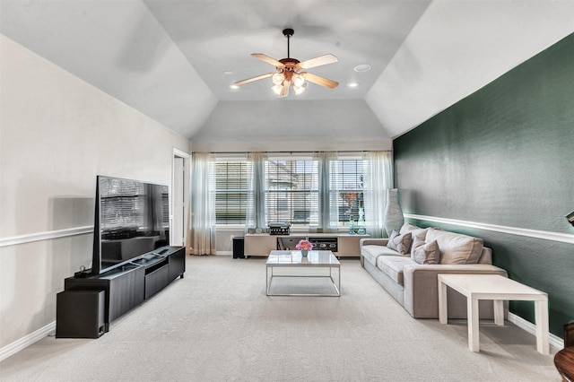 living room with vaulted ceiling, ceiling fan, and carpet