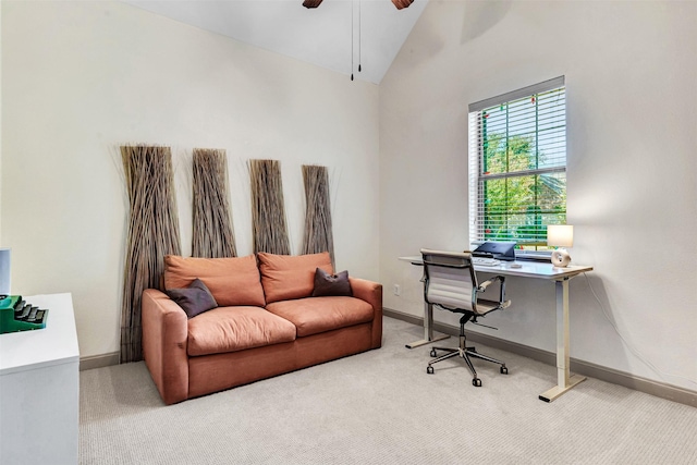 office featuring ceiling fan, light colored carpet, and high vaulted ceiling