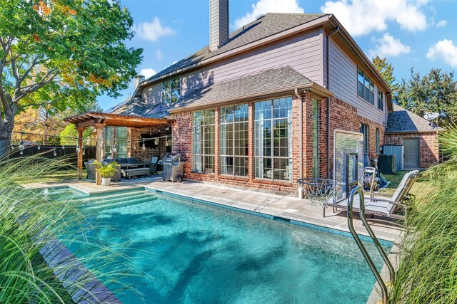 view of swimming pool featuring a grill, an outdoor hangout area, and a patio