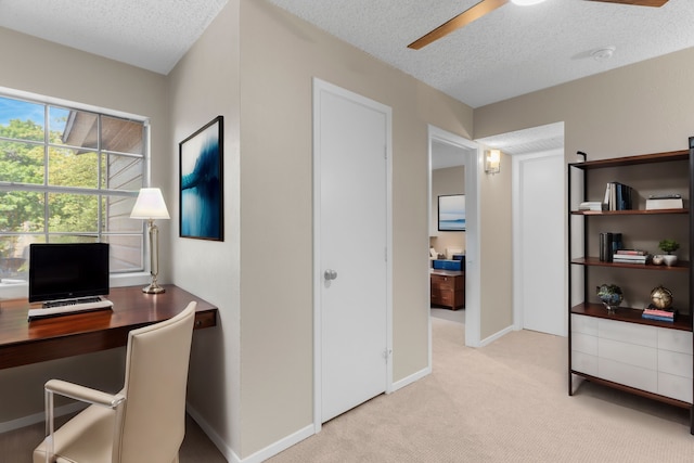 office with light carpet, a textured ceiling, and ceiling fan