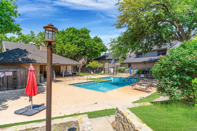 view of swimming pool with a patio