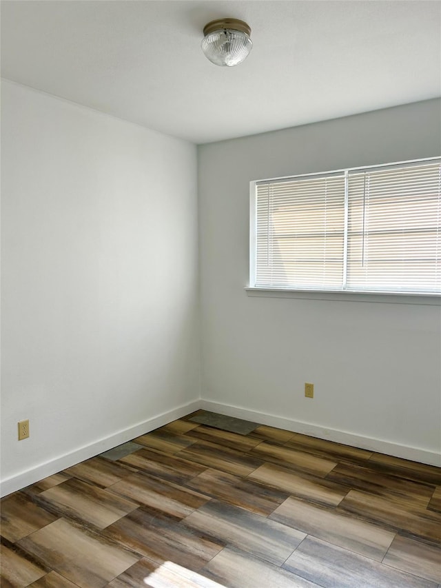 empty room with hardwood / wood-style floors