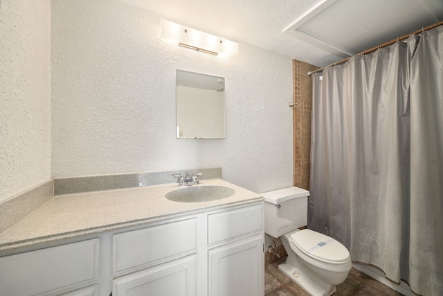 bathroom featuring a shower with curtain, vanity, and toilet