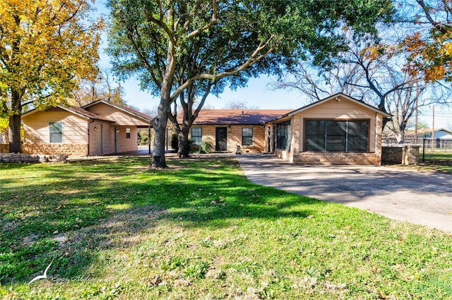 ranch-style home with a front lawn