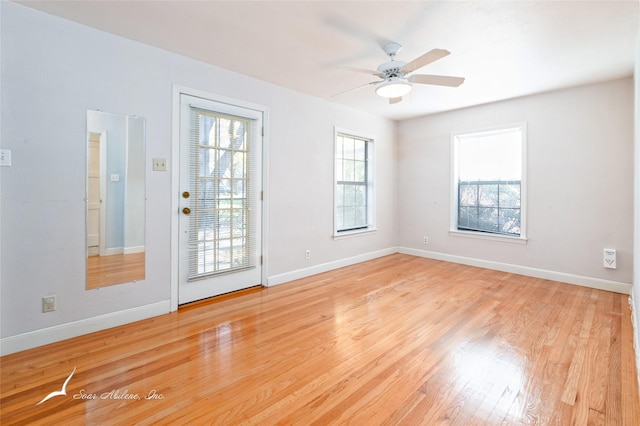 unfurnished room with ceiling fan and light hardwood / wood-style flooring