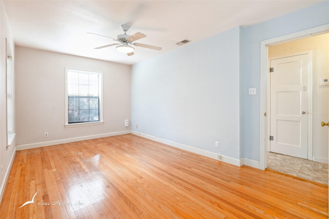 unfurnished room with light hardwood / wood-style flooring and ceiling fan