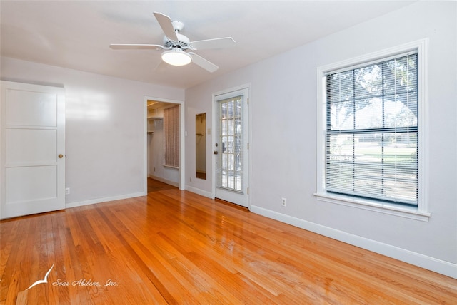 unfurnished room featuring light hardwood / wood-style floors and ceiling fan