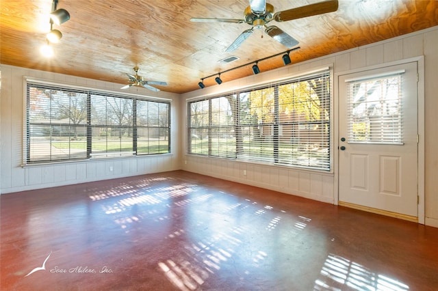 unfurnished sunroom featuring ceiling fan and wood ceiling