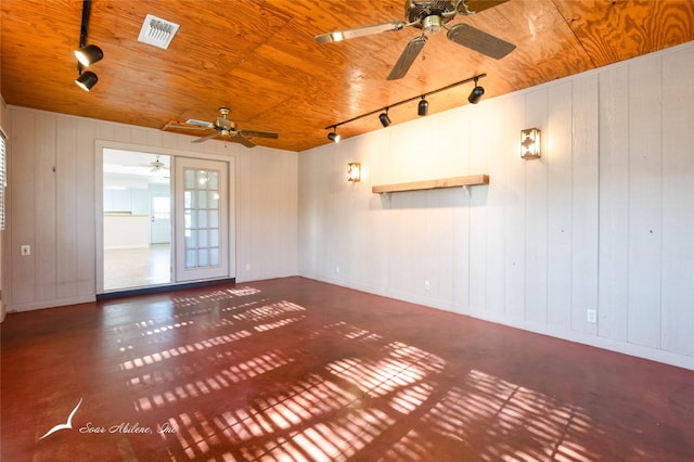 unfurnished room with wooden walls, ceiling fan, and wooden ceiling