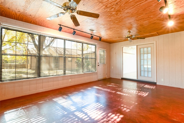 unfurnished room featuring ceiling fan, plenty of natural light, and wooden ceiling