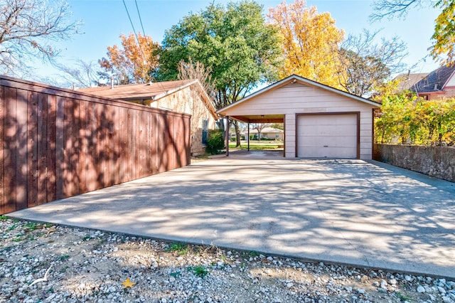 garage featuring a carport