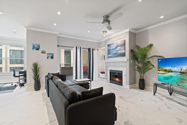 living room with ornamental molding and ceiling fan