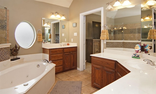 bathroom with lofted ceiling, vanity, independent shower and bath, and tile patterned flooring