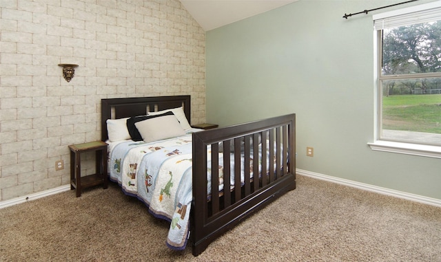 bedroom featuring carpet flooring, multiple windows, and lofted ceiling