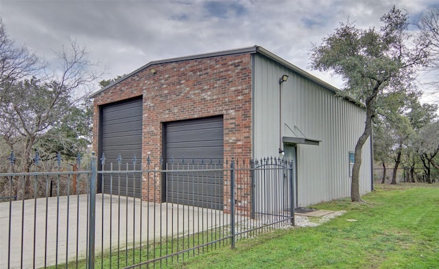 garage featuring a lawn