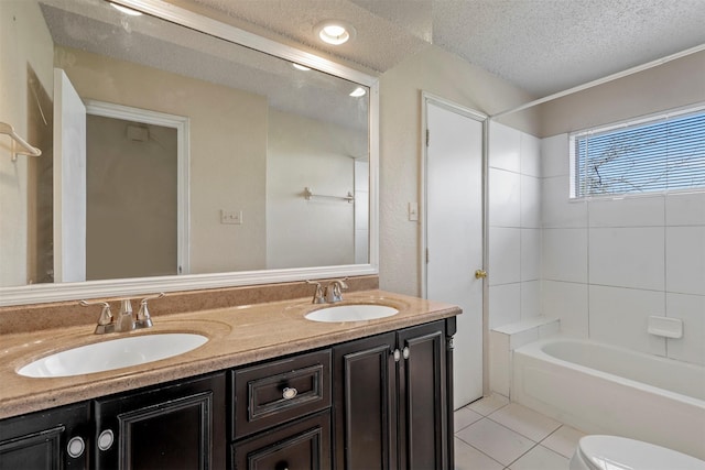 full bathroom with tile patterned floors, a textured ceiling, toilet, shower / washtub combination, and vanity