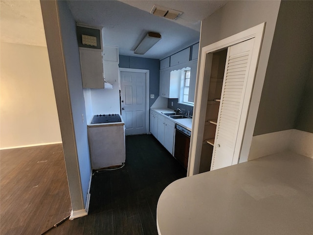 kitchen featuring stove, dark wood-type flooring, sink, white cabinets, and black dishwasher