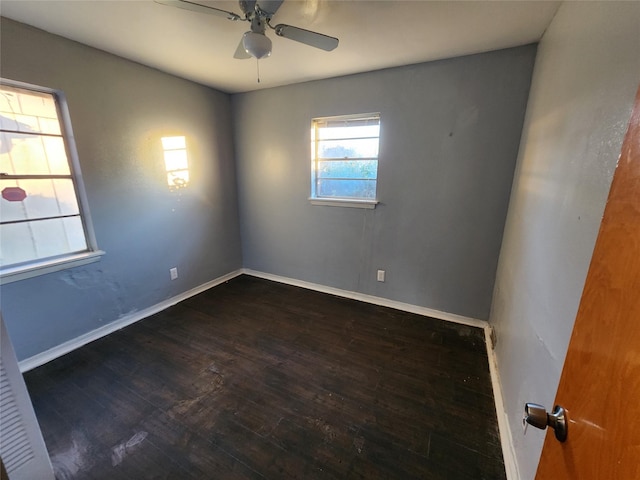 unfurnished room featuring ceiling fan and dark hardwood / wood-style flooring