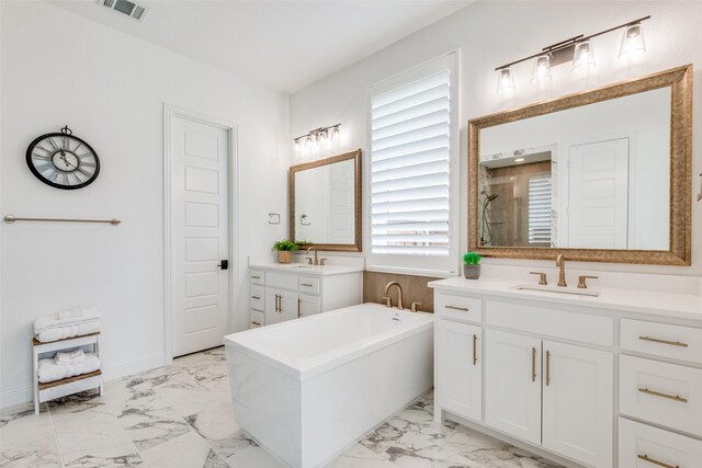 bathroom with vanity and independent shower and bath