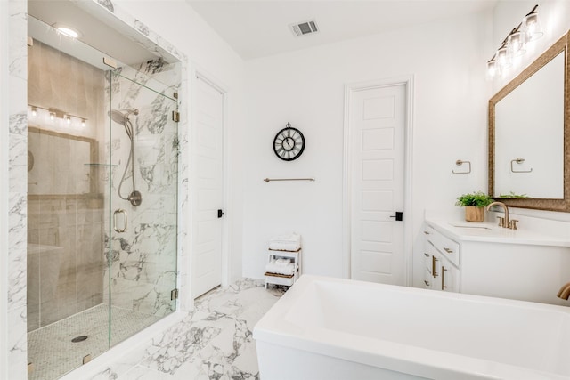 bathroom with vanity and separate shower and tub