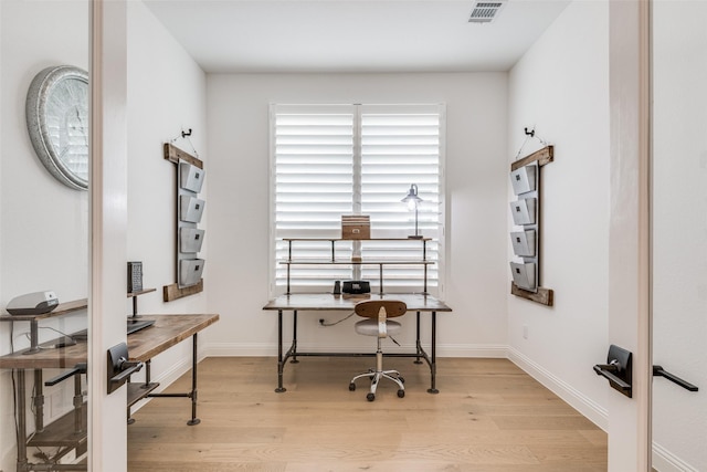 office space featuring light hardwood / wood-style floors