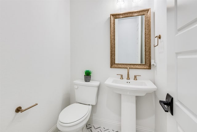 bathroom with toilet and sink