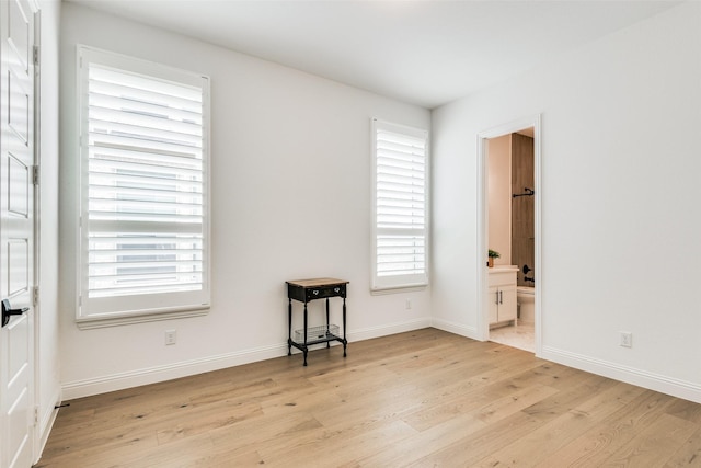 spare room featuring light hardwood / wood-style floors