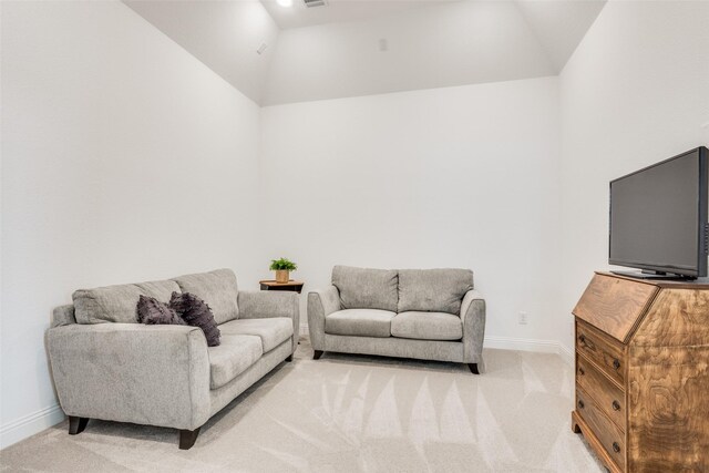 living room with light colored carpet and lofted ceiling